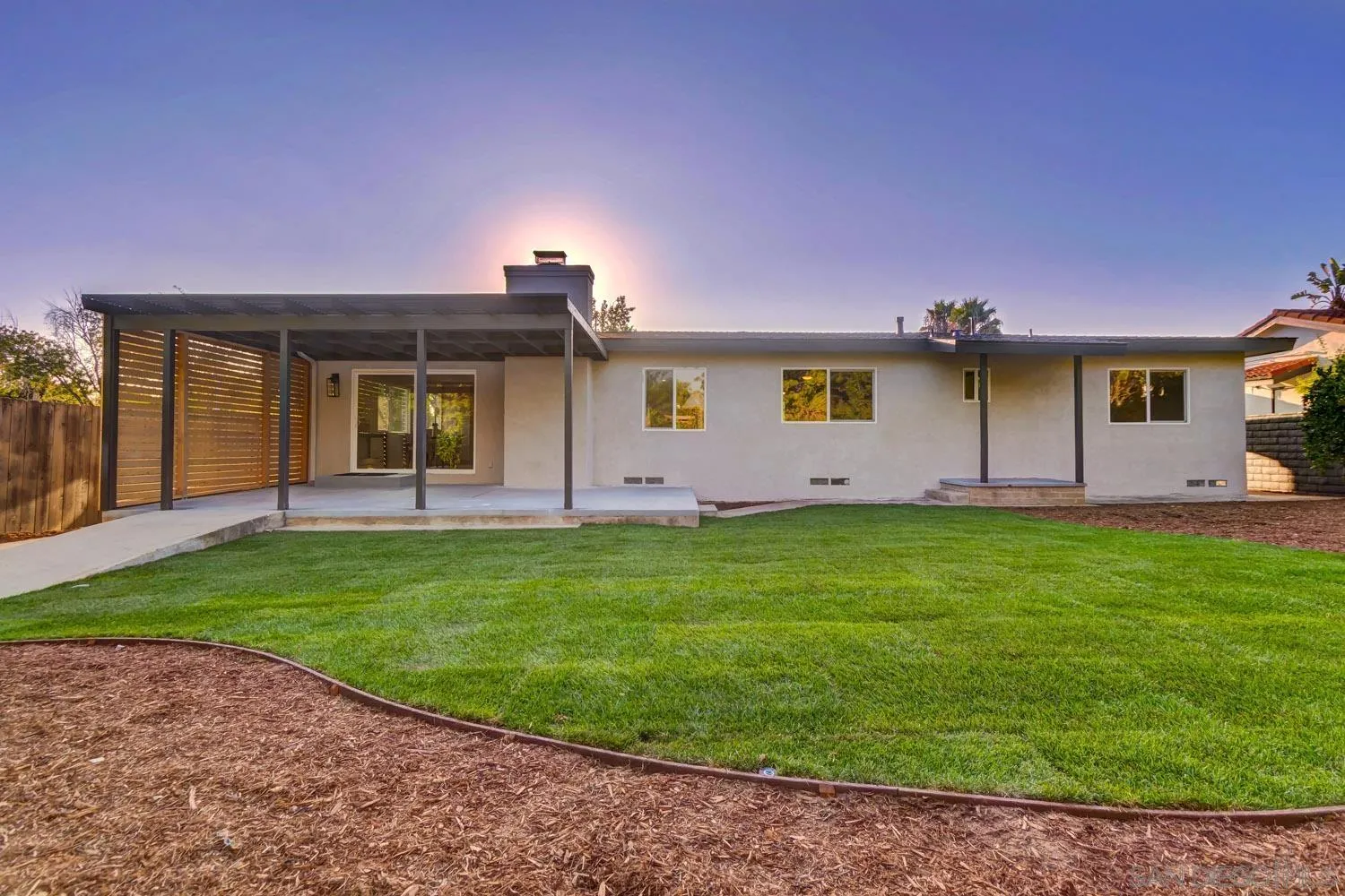 5701 Madra Avenue San Diego, CA 92120 - Photo 2 of 15 a front view of a house with a garden