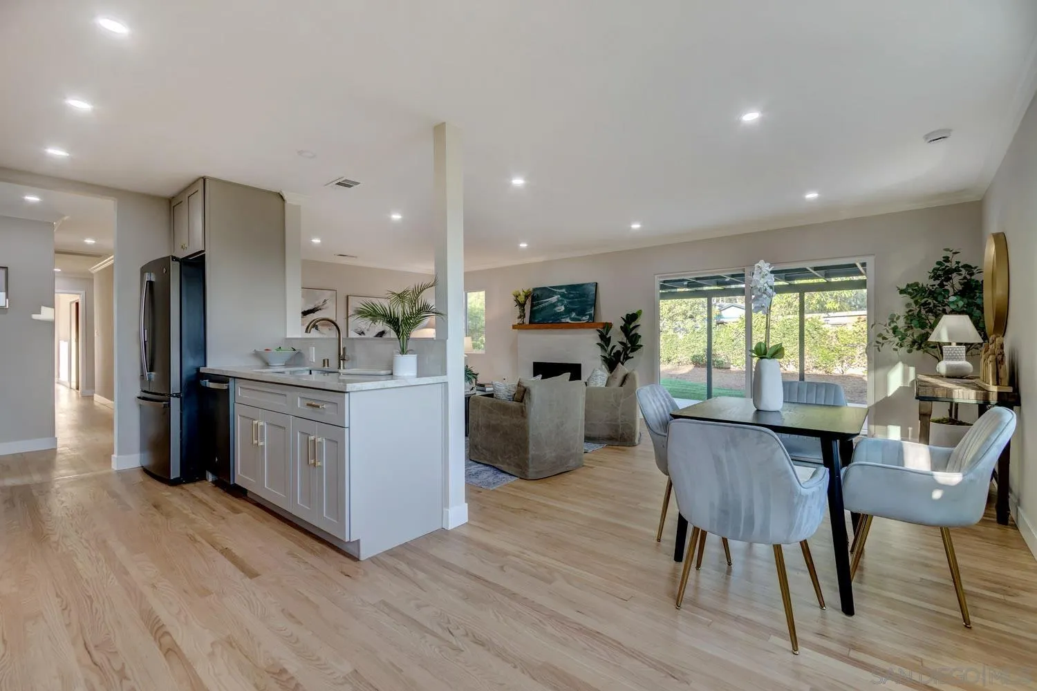 5701 Madra Avenue San Diego, CA 92120 - Photo 3 of 15 a kitchen with a table and chairs in it