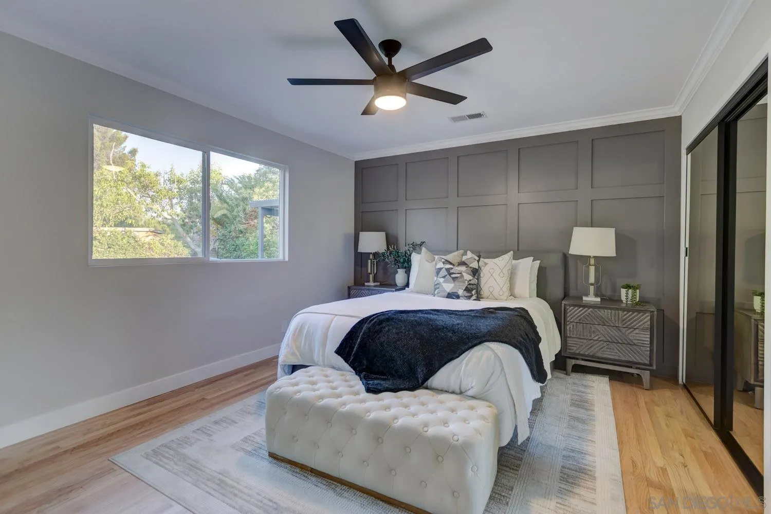 5701 Madra Avenue San Diego, CA 92120 - Photo 10 of 15 a bedroom with a bed and window