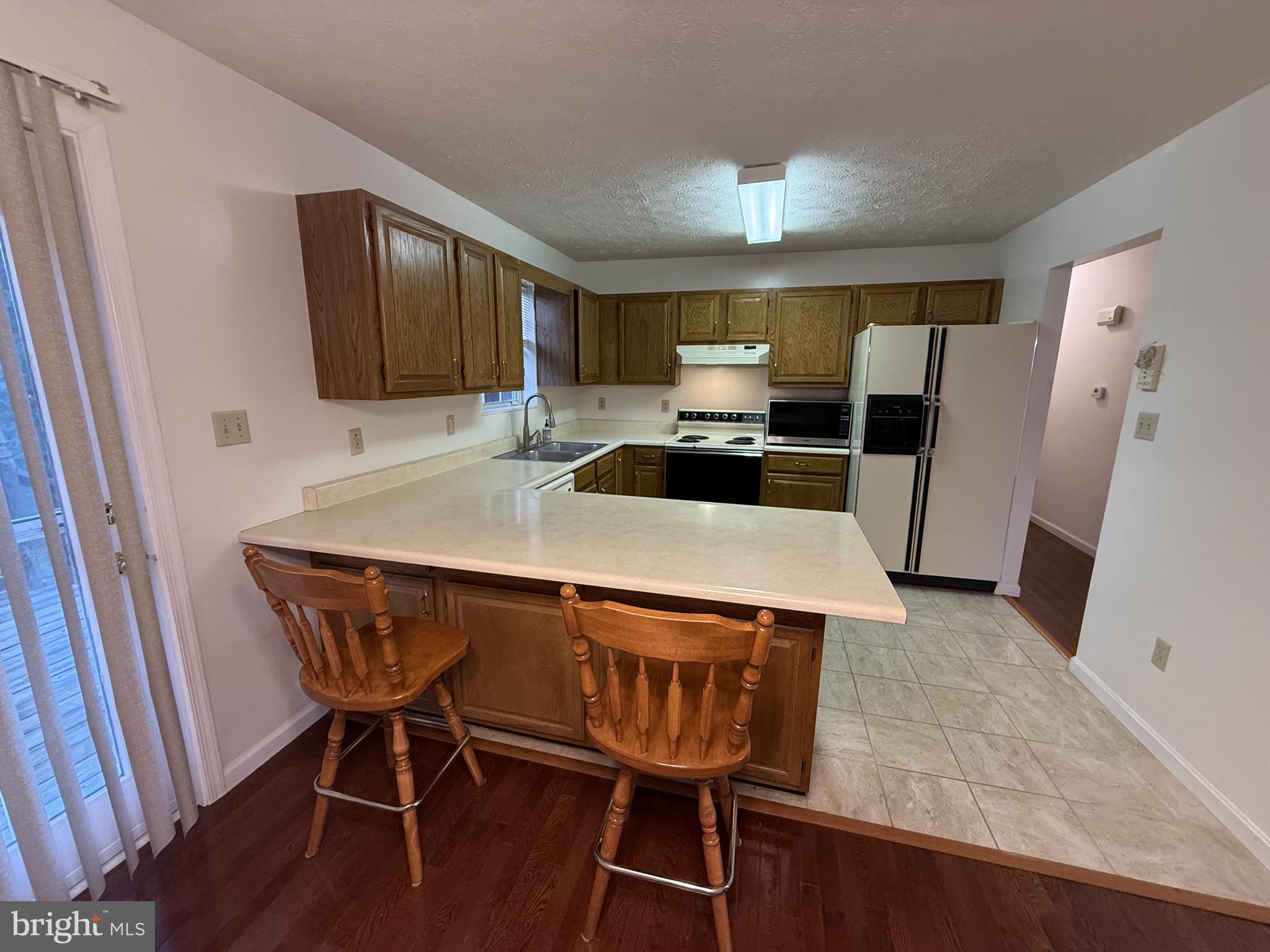 21 Coolidge Road Inwood, WV 25428 - Photo 31 of 80 Open Kitchen & Dining Area with Breakfast Bar