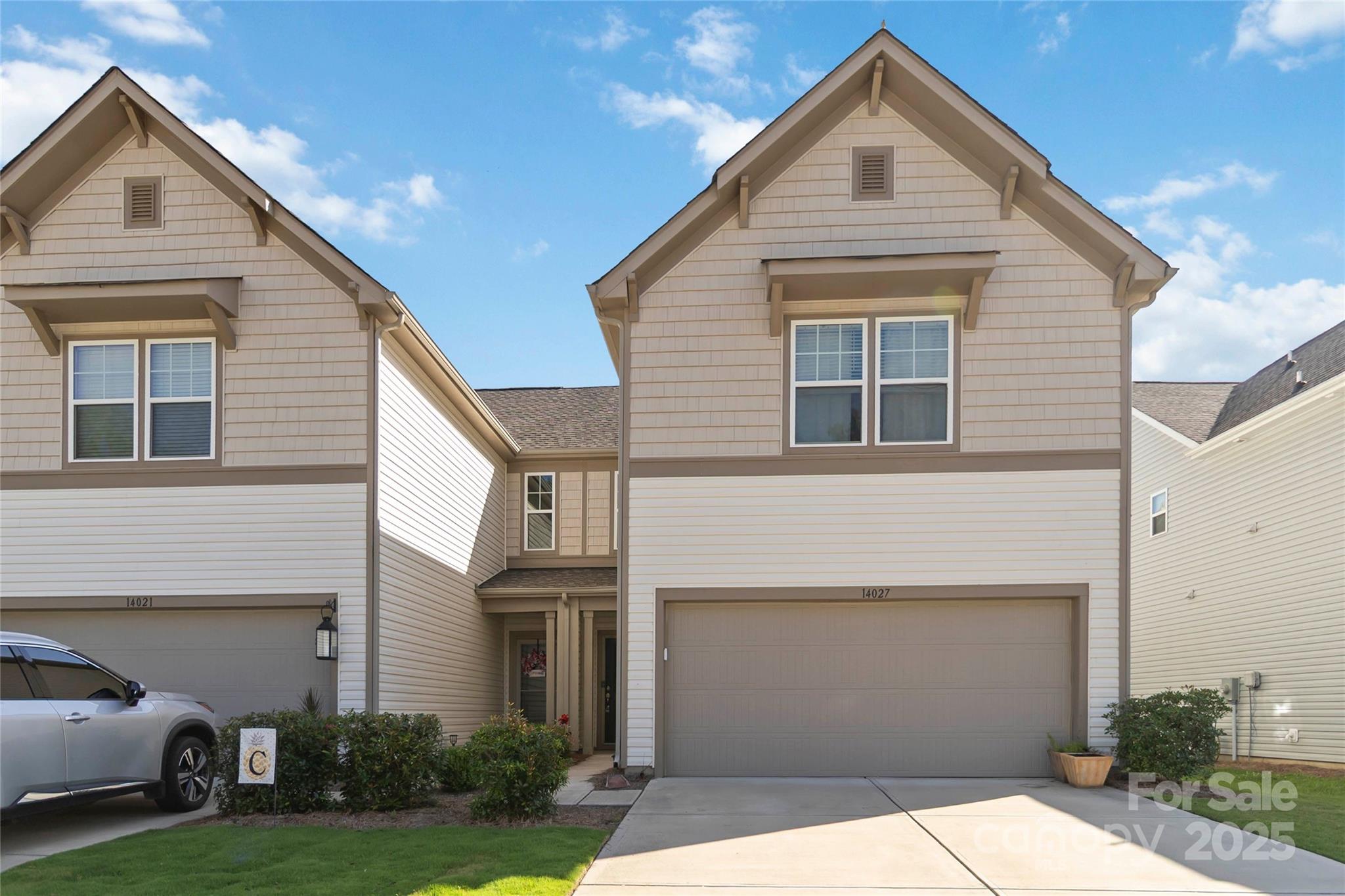 14027 Clayborn Street Midland, NC 28107 - Photo 3 of 35 a view of a white house next to a yard