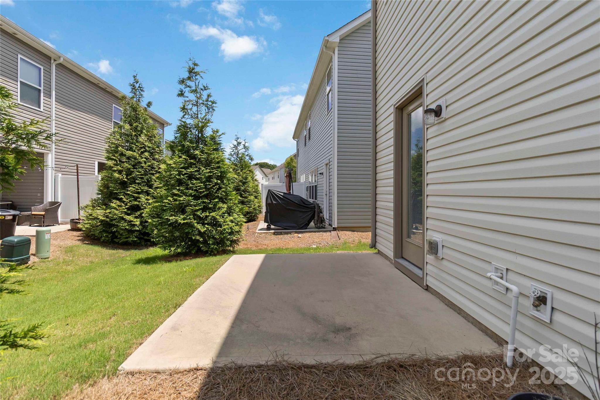 14027 Clayborn Street Midland, NC 28107 - Photo 34 of 35 a view of a back yard of the house