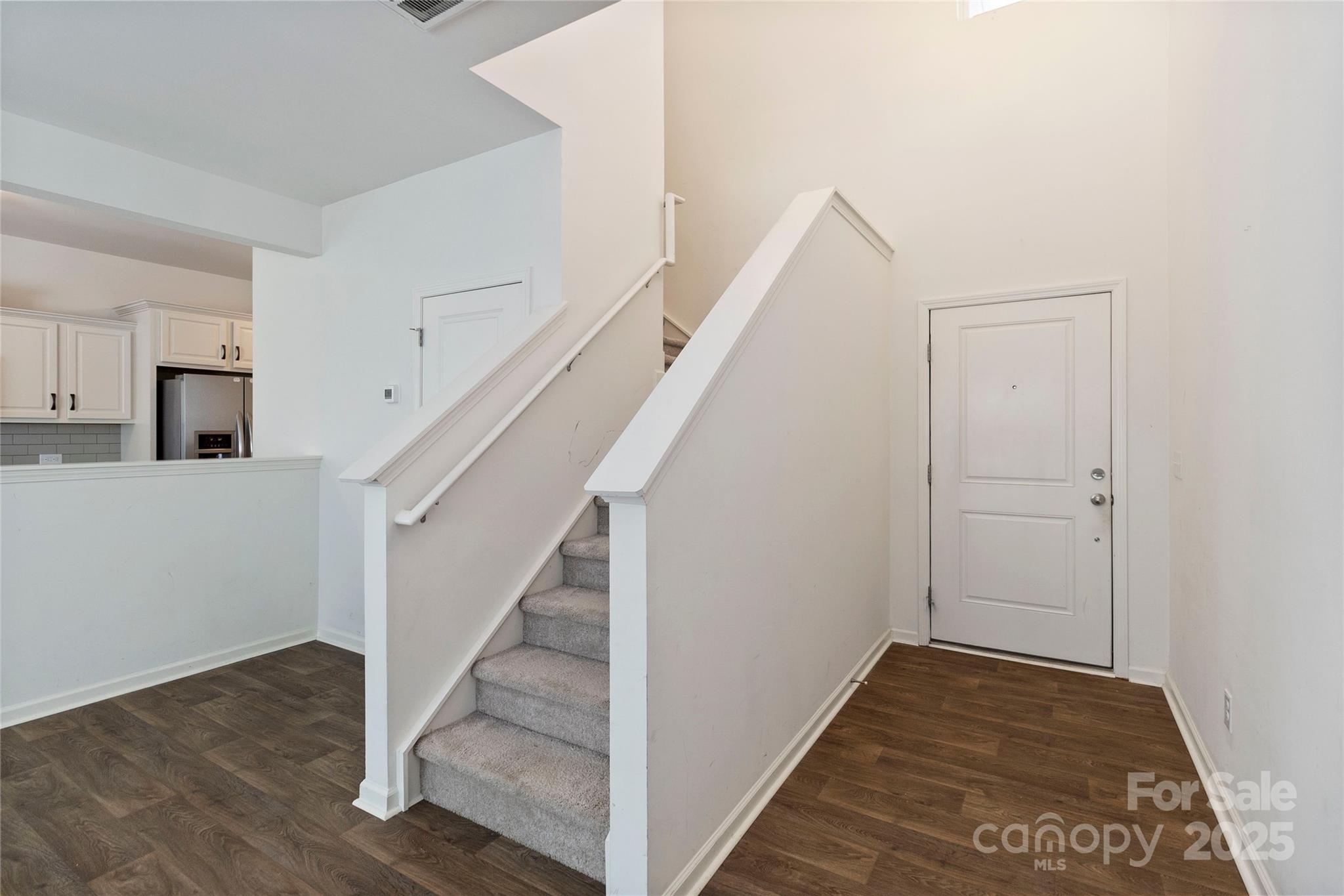 14027 Clayborn Street Midland, NC 28107 - Photo 6 of 35 a view of a hallway with wooden floor and entryway