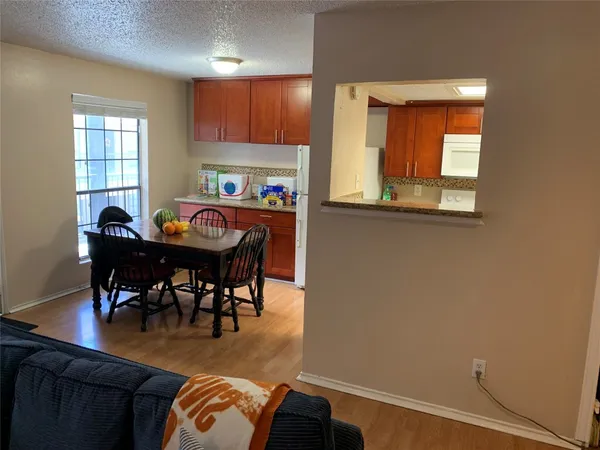 a view of a dining room with furniture and window