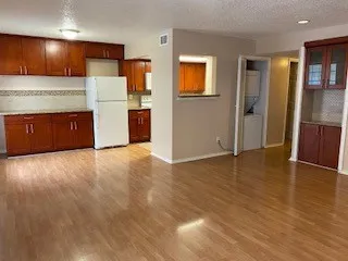a view of kitchen with wooden floor