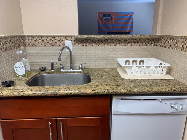 a bathroom with sink and mirror