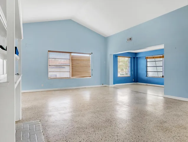 an empty room with windows