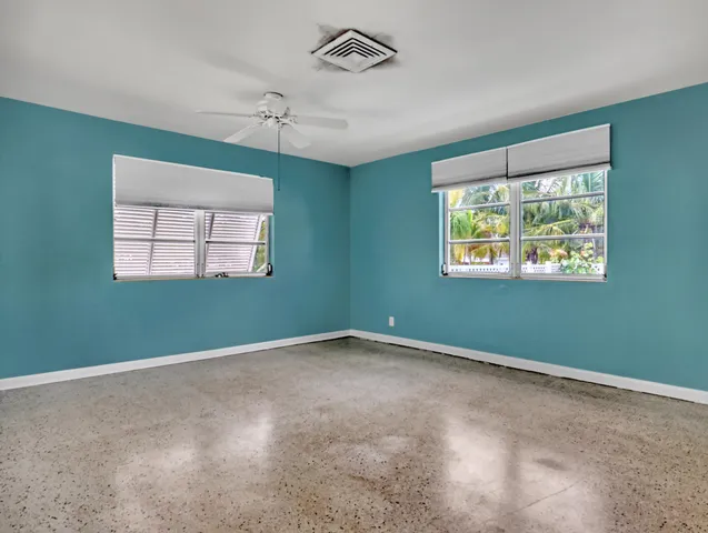 an empty room with windows