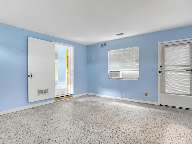 a view of an empty room with a window