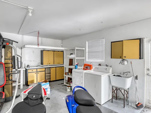 a view of a living room and kitchen