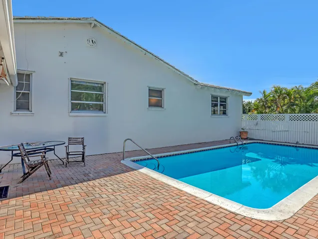 a view of a backyard with a small cabin