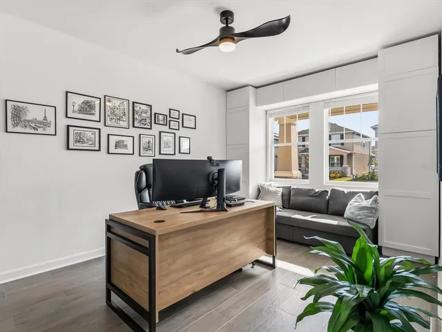 a view of a town with palm trees