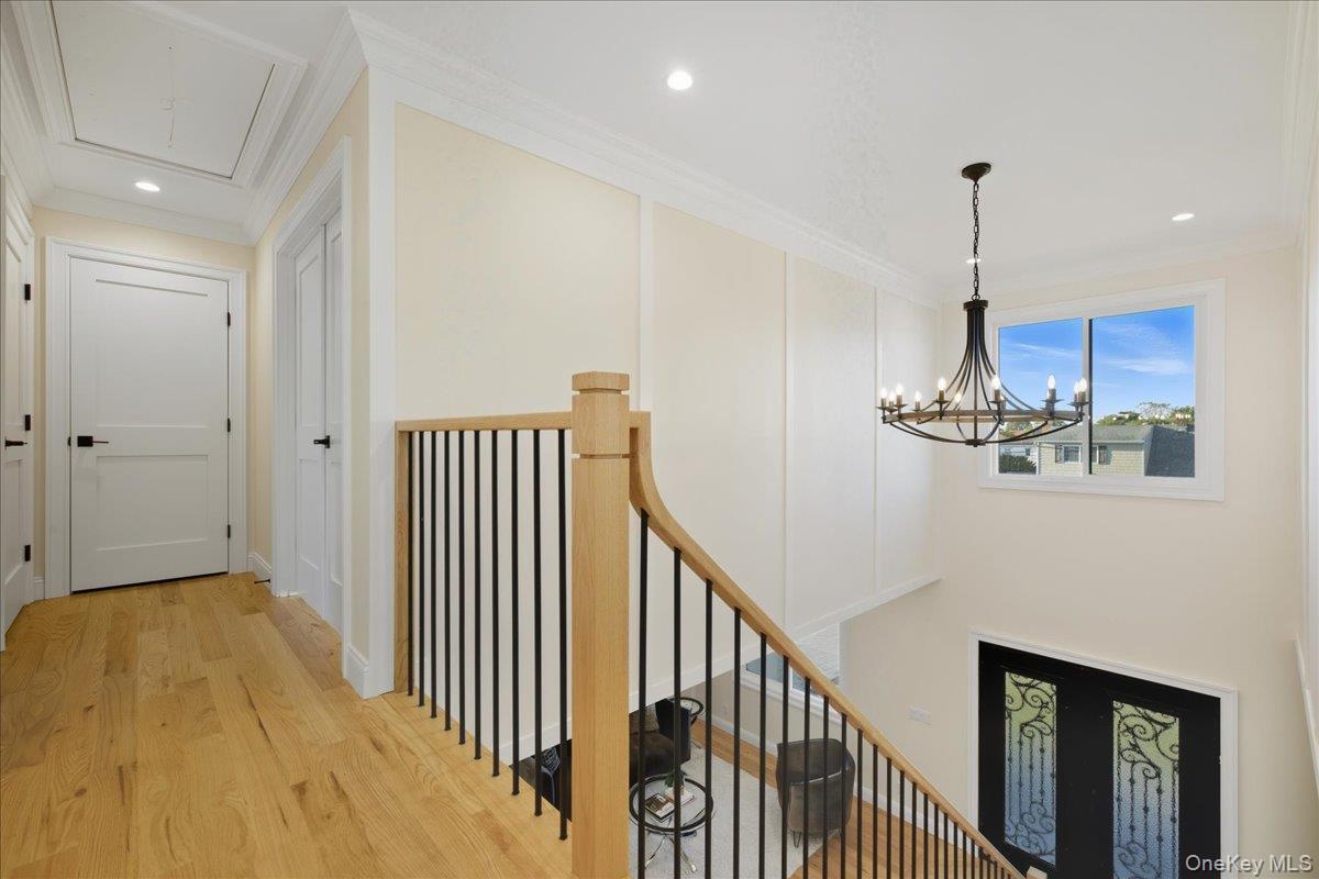 3 Bentley Road Plainview, NY 11803 - Photo 25 of 41 a view of a hallway with an entryway and chandelier
