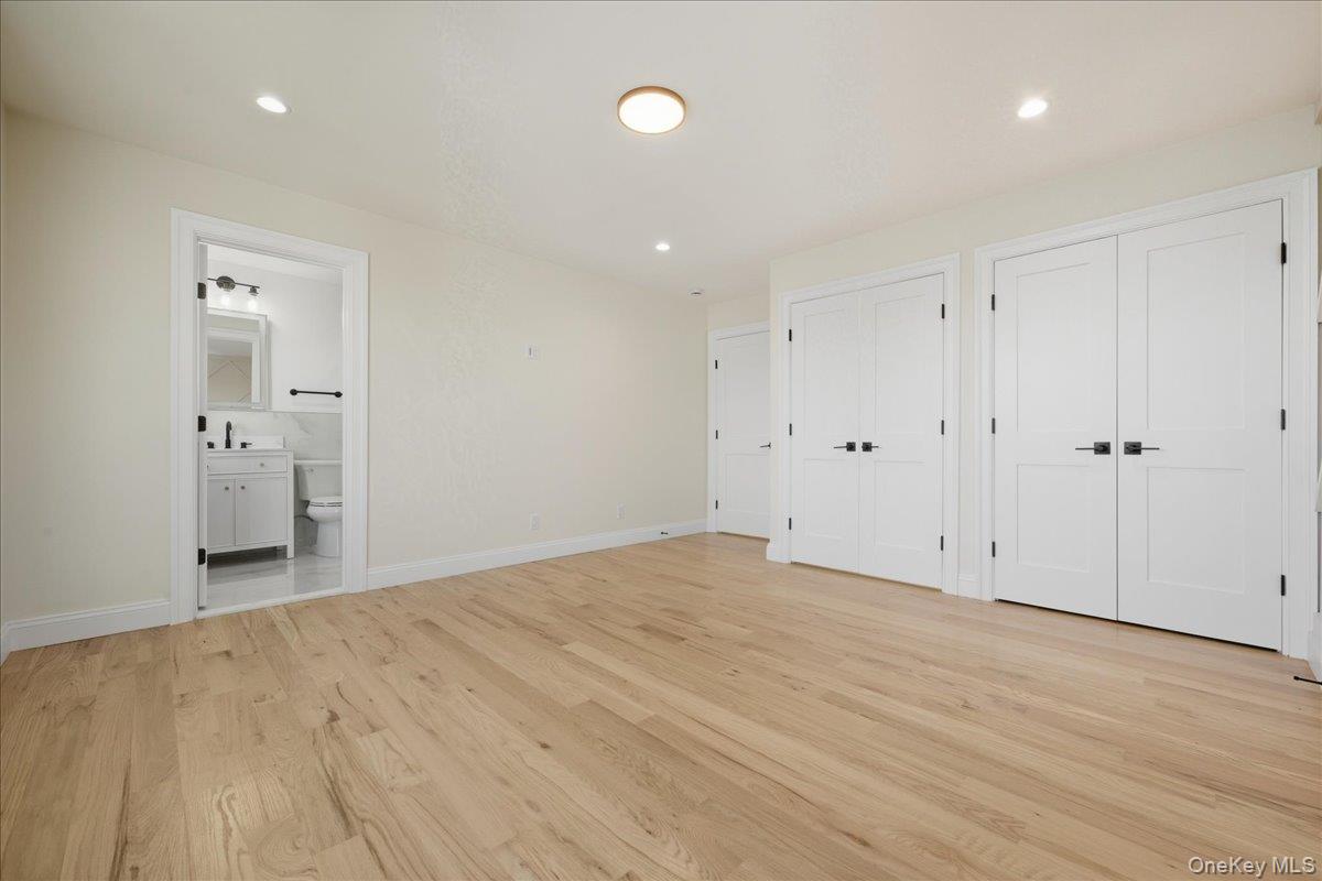 3 Bentley Road Plainview, NY 11803 - Photo 33 of 41 a view of an empty room with wooden floor