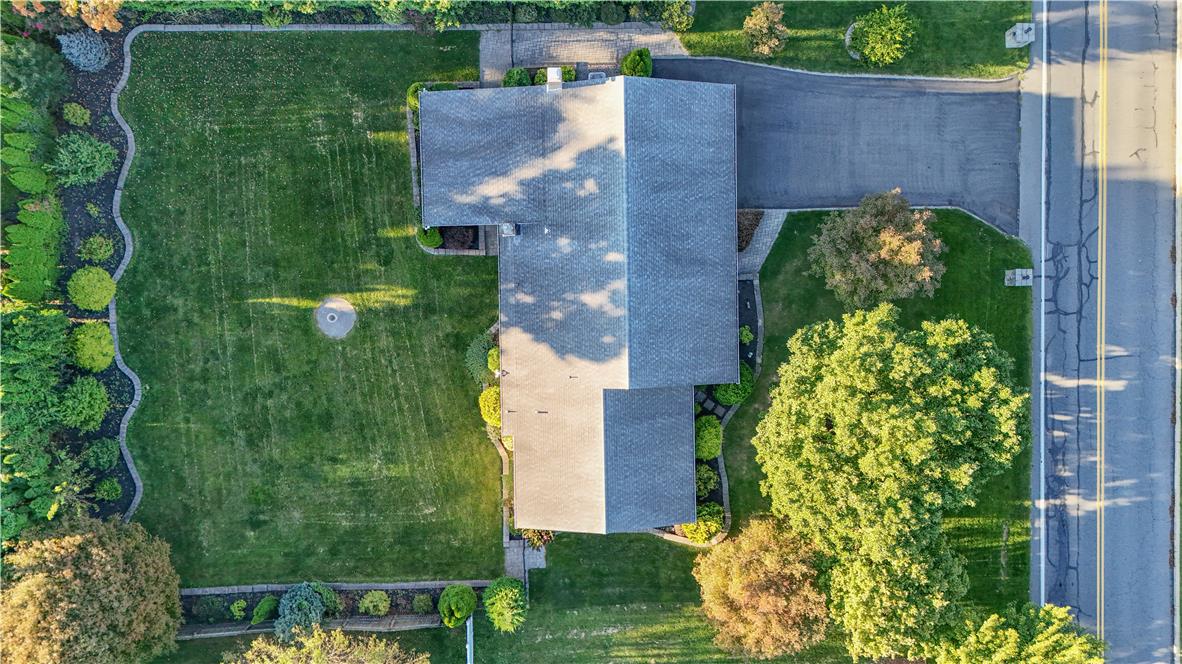 3915 Hecktown Road Bethlehem, PA 18020 - Photo 38 of 42 An aerial perspective showcases the structured asphalt driveway, shingle roof, and expansive manicured lawn.