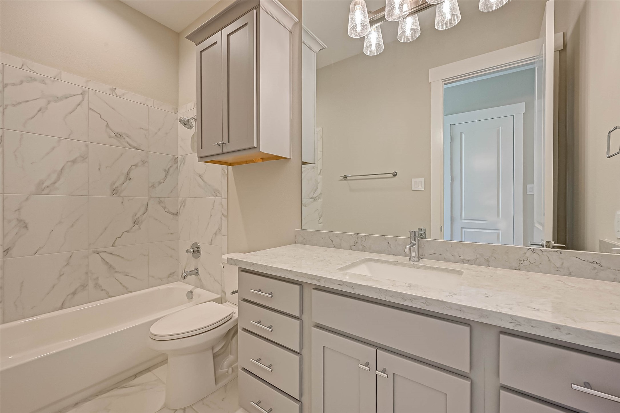 67 Thorpe Lane Spring, TX 77389 - Photo 18 of 27 a bathroom with a granite countertop sink a toilet and bathtub