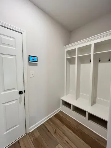 a view of wooden floor and entryway