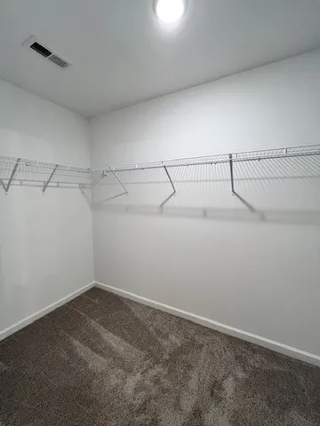 a view of a room with racks on the wall