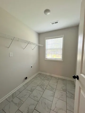 a view of a room that has a window in it