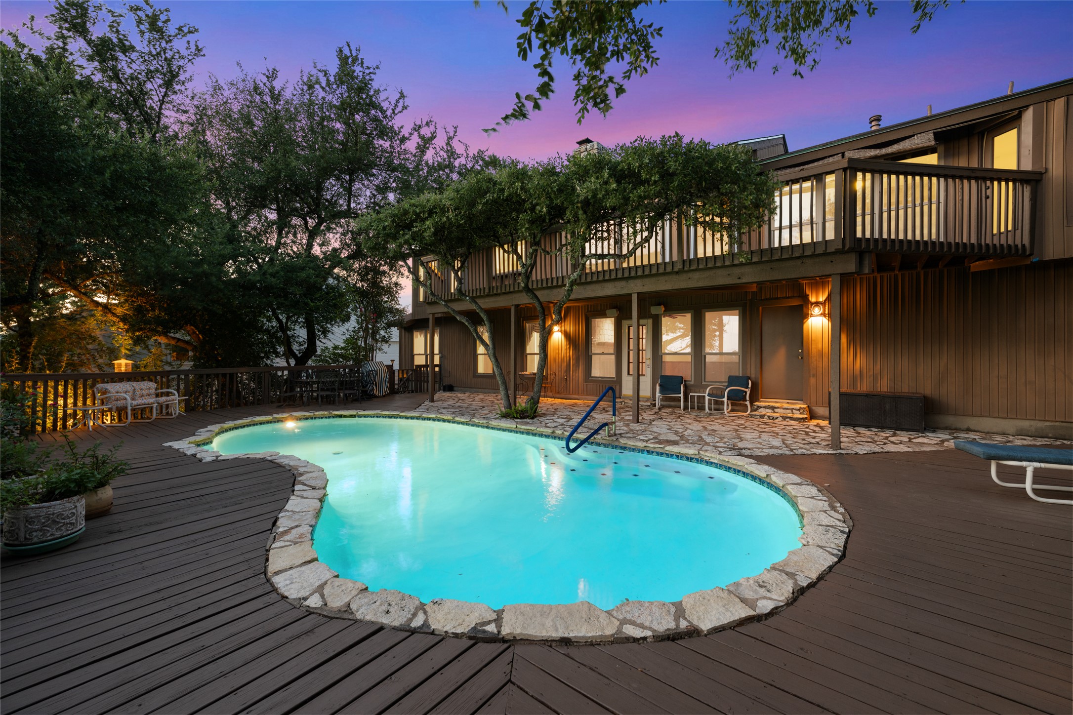 5319 Musket Ridge Austin, TX 78759 - Photo 35 of 39 An inviting pool, outlined with natural stone, forms the centerpiece of this multi-level outdoor living space.
