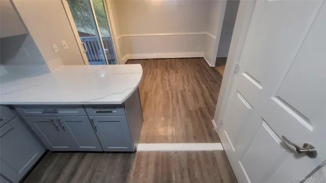 a view of wooden floor in a kitchen