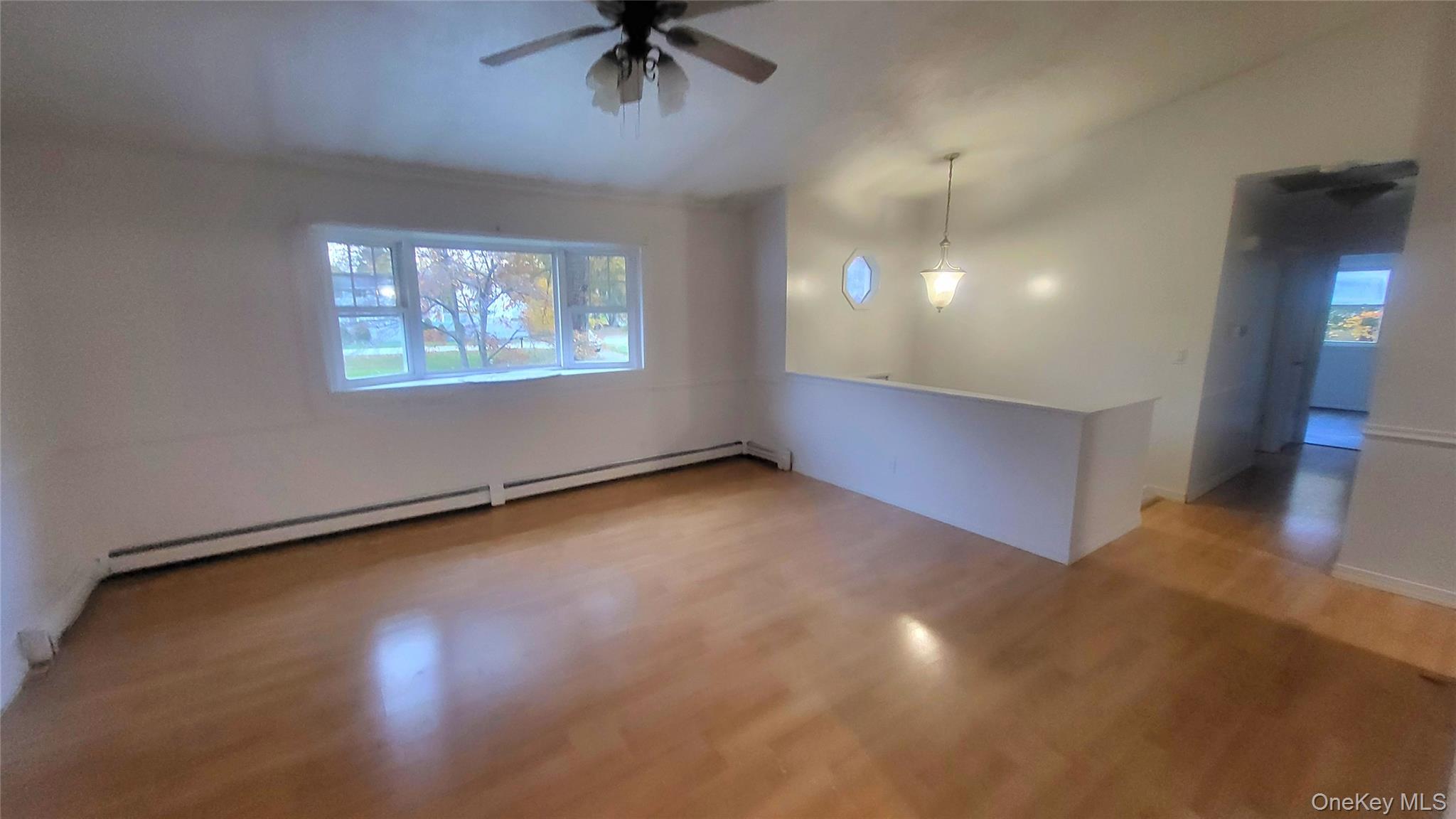 11 Pleasant Lane Poughkeepsie, NY 12603 - Photo 4 of 12 a view of an empty room with a window
