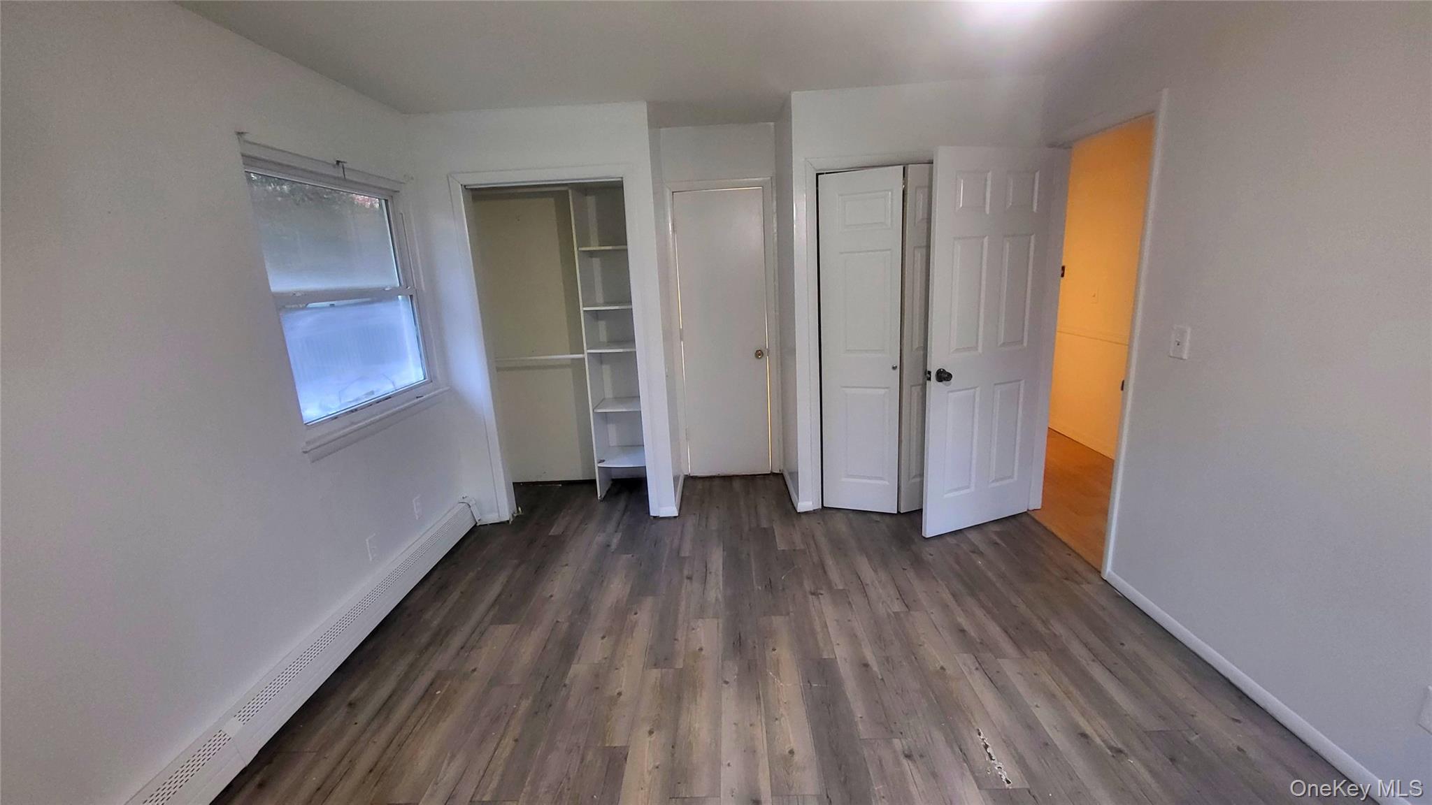 11 Pleasant Lane Poughkeepsie, NY 12603 - Photo 6 of 12 a view of a room with wooden floor and a window