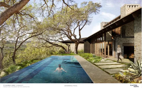 an aerial view of a house with yard and outdoor seating
