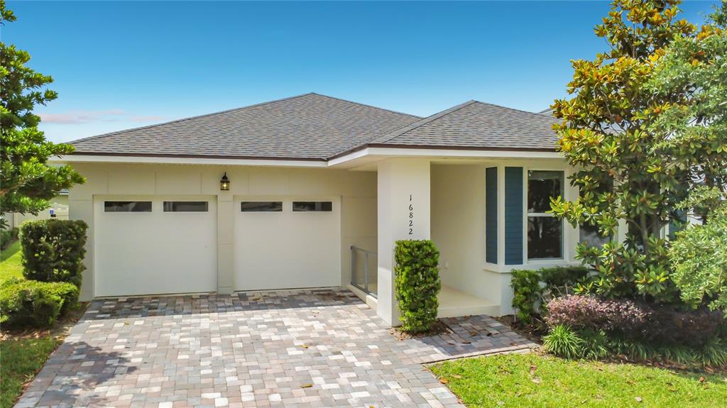 16822 Wingspread Loop Winter Garden, FL 34787 - Photo 11 of 47 front view of a house with a yard