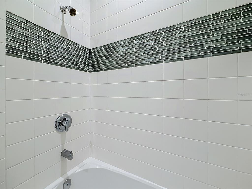 16822 Wingspread Loop Winter Garden, FL 34787 - Photo 30 of 47 a bathroom with a shower