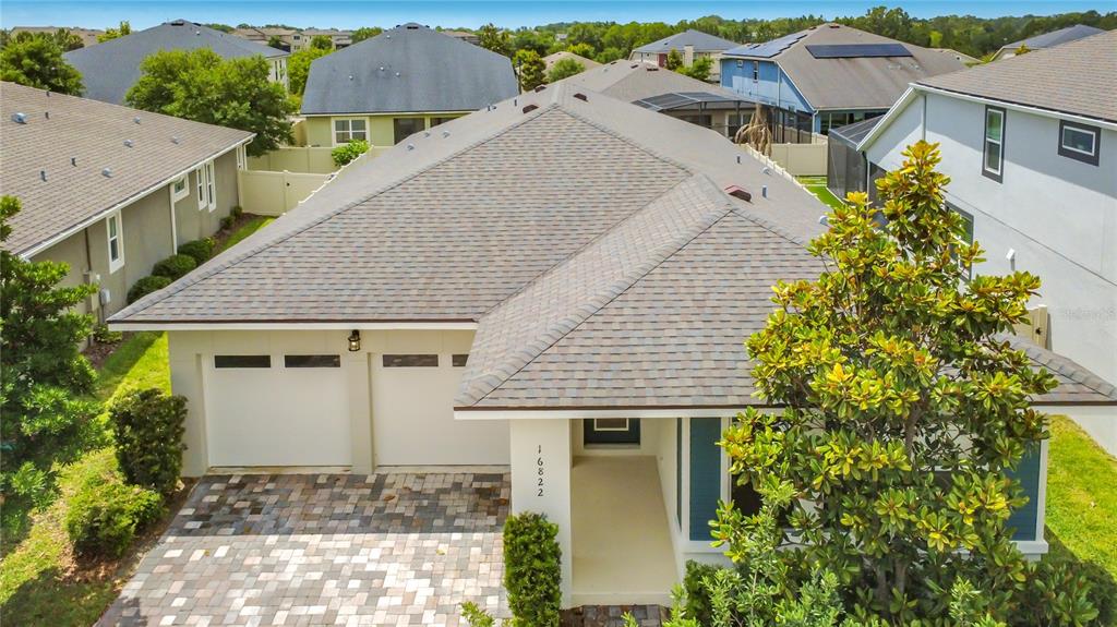 16822 Wingspread Loop Winter Garden, FL 34787 - Photo 3 of 47 an aerial view of a house with a yard