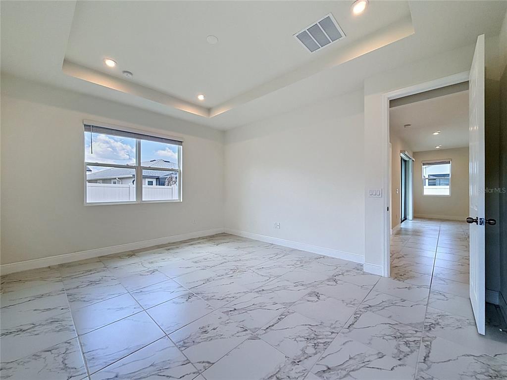 16822 Wingspread Loop Winter Garden, FL 34787 - Photo 32 of 47 a view of livingroom with hardwood floor and hallway