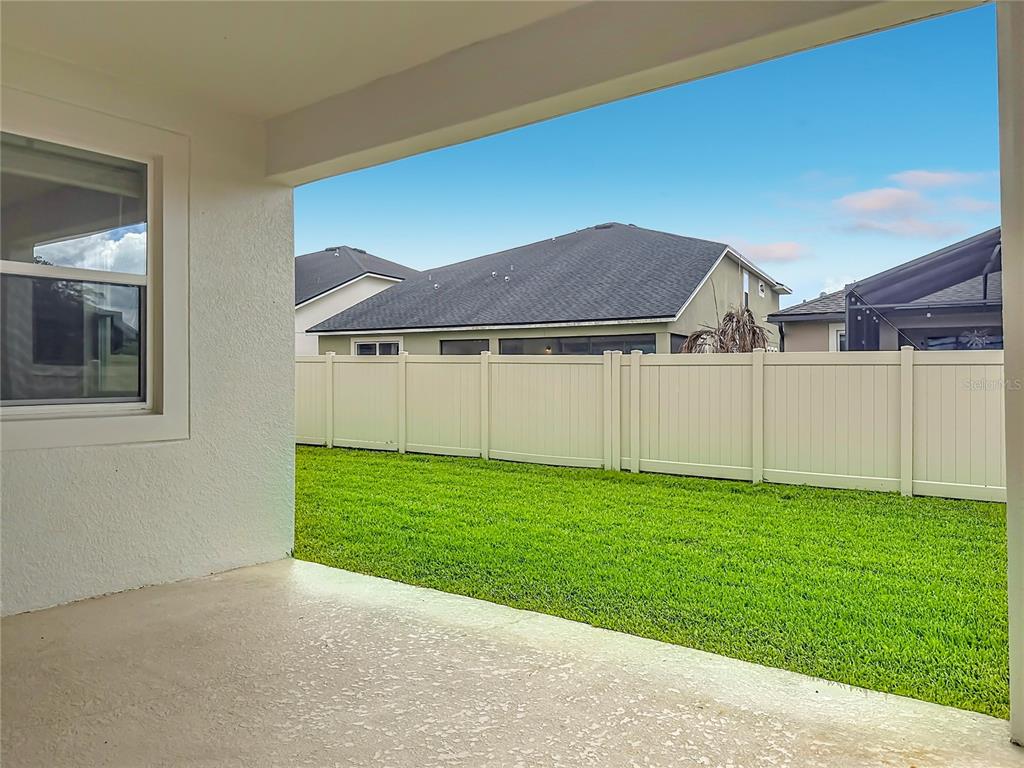 16822 Wingspread Loop Winter Garden, FL 34787 - Photo 37 of 47 a view of a house with a backyard