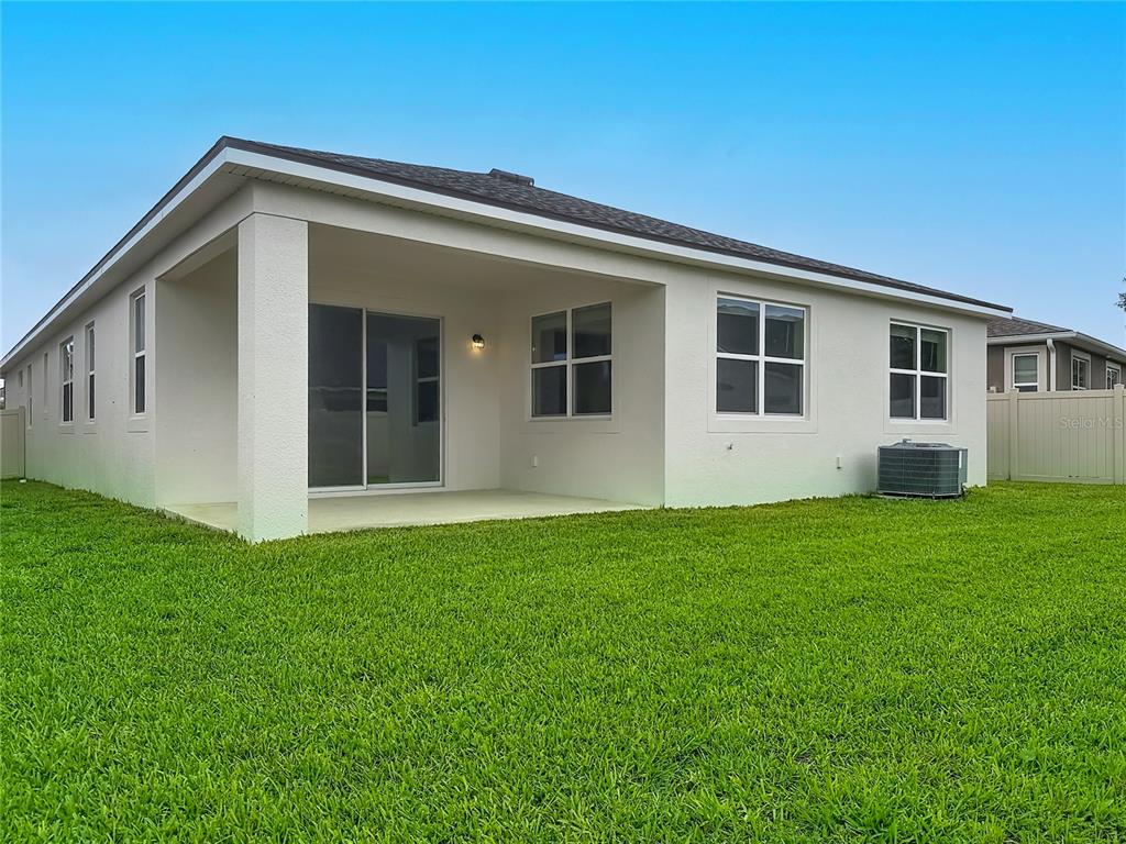 16822 Wingspread Loop Winter Garden, FL 34787 - Photo 40 of 47 a front view of house with yard and green space