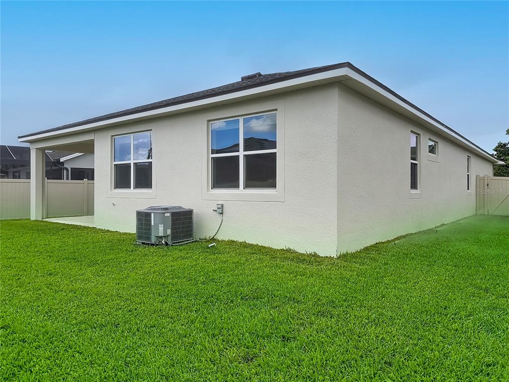 16822 Wingspread Loop Winter Garden, FL 34787 - Photo 41 of 47 a house that has a big yard with wooden fence