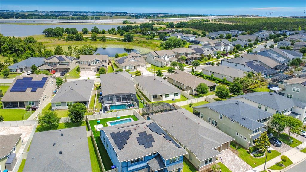 16822 Wingspread Loop Winter Garden, FL 34787 - Photo 47 of 47 an aerial view of residential houses with outdoor space and river