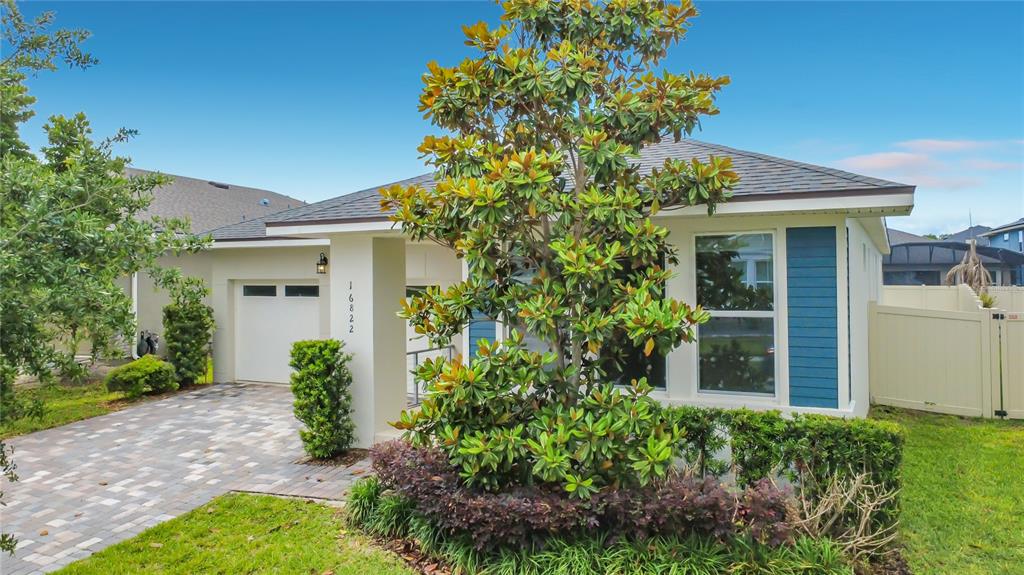 16822 Wingspread Loop Winter Garden, FL 34787 - Photo 9 of 47 front view of a house with a yard