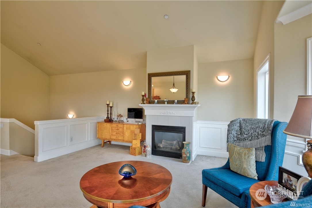 3315 Rockefeller Avenue, Unit 4 Everett, WA 98201 - Photo 22 of 29 a living room with furniture and a fireplace