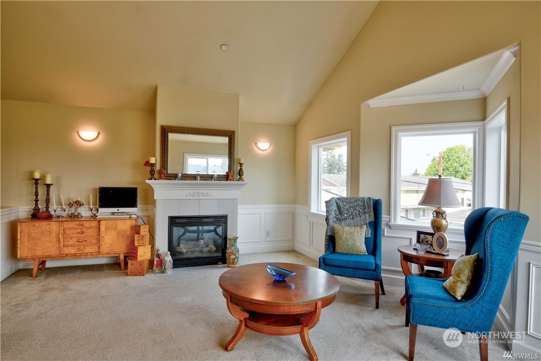 3315 Rockefeller Avenue, Unit 4 Everett, WA 98201 - Photo 3 of 29 a living room with furniture a rug and a fireplace