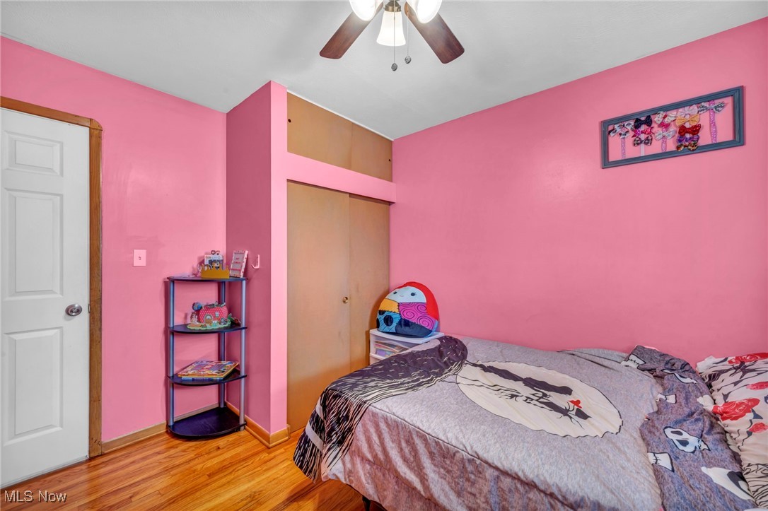 15025 Holland Road Brook Park, OH 44142 - Photo 9 of 12 Bedroom featuring light wood finished floors, a closet, and ceiling fan