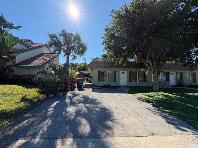 a bathroom with a sink mirror toilet and bathtub