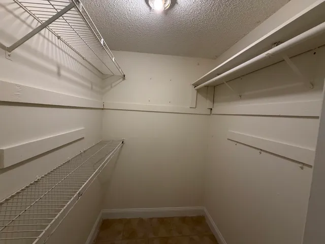 a view of a room with racks on the wall