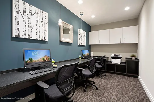 a view of a workspace with furniture