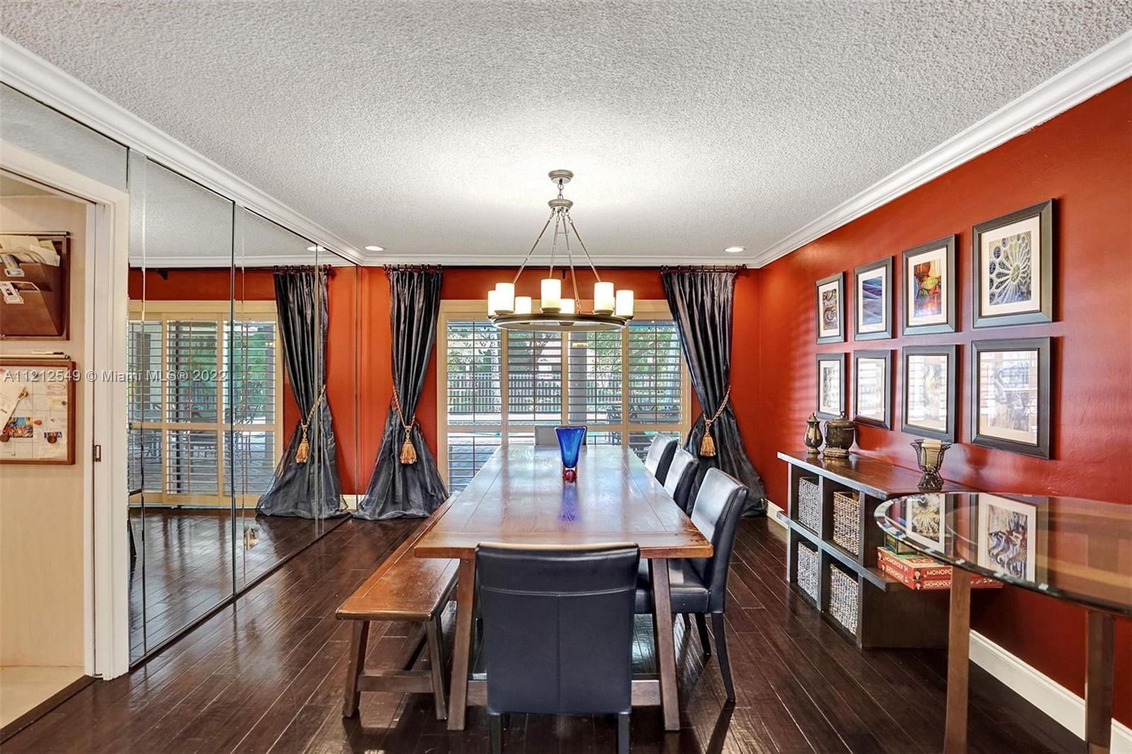 7360 Southwest 16th Street Plantation, FL 33317 - Photo 12 of 70 a view of a dining room with furniture window and wooden floor