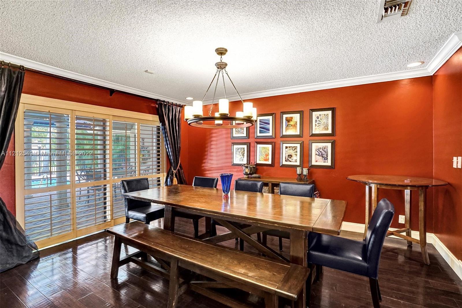7360 Southwest 16th Street Plantation, FL 33317 - Photo 13 of 70 a view of a dining room with furniture window and wooden floor