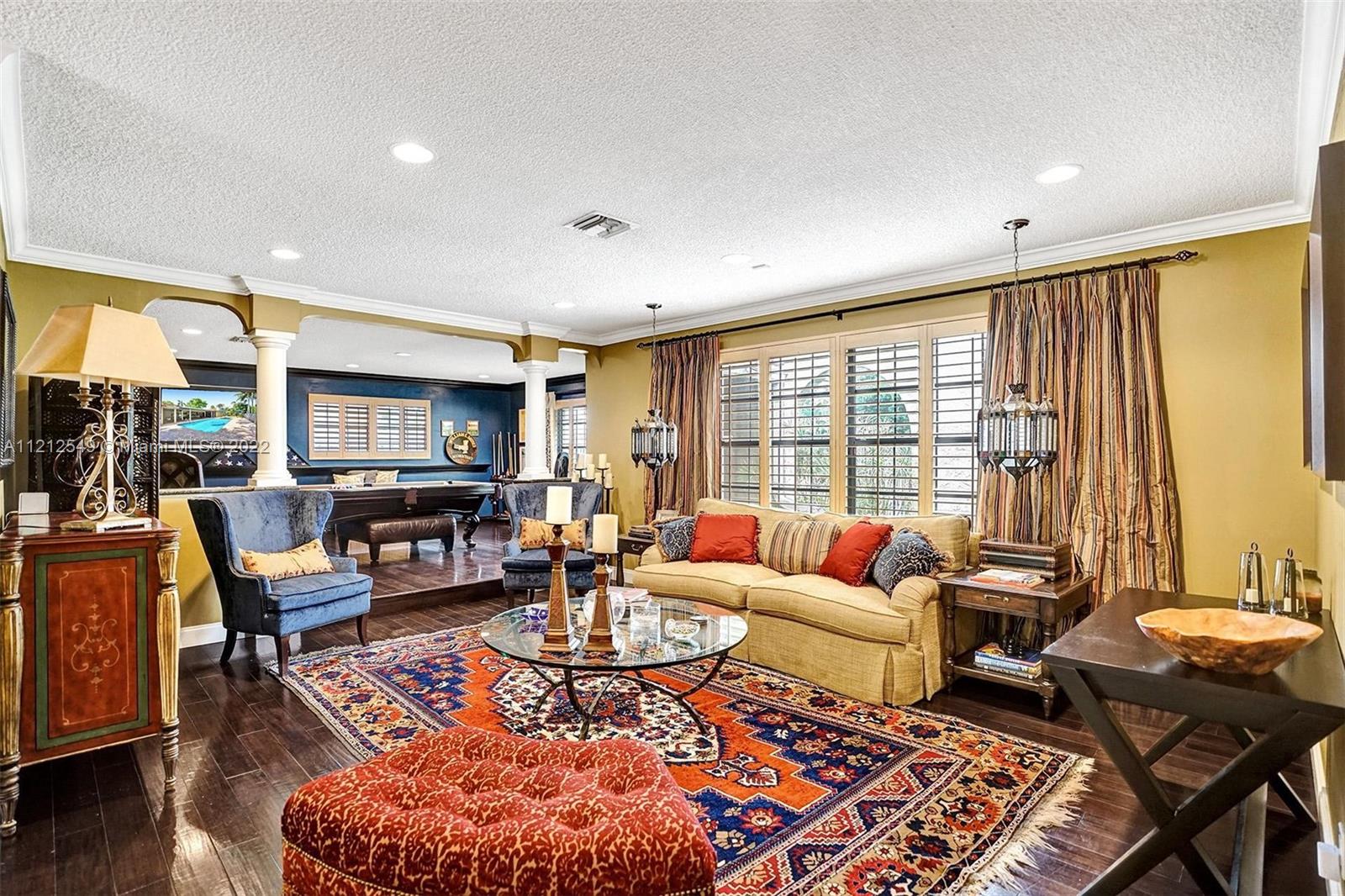 7360 Southwest 16th Street Plantation, FL 33317 - Photo 16 of 70 a living room with furniture a rug and a large window