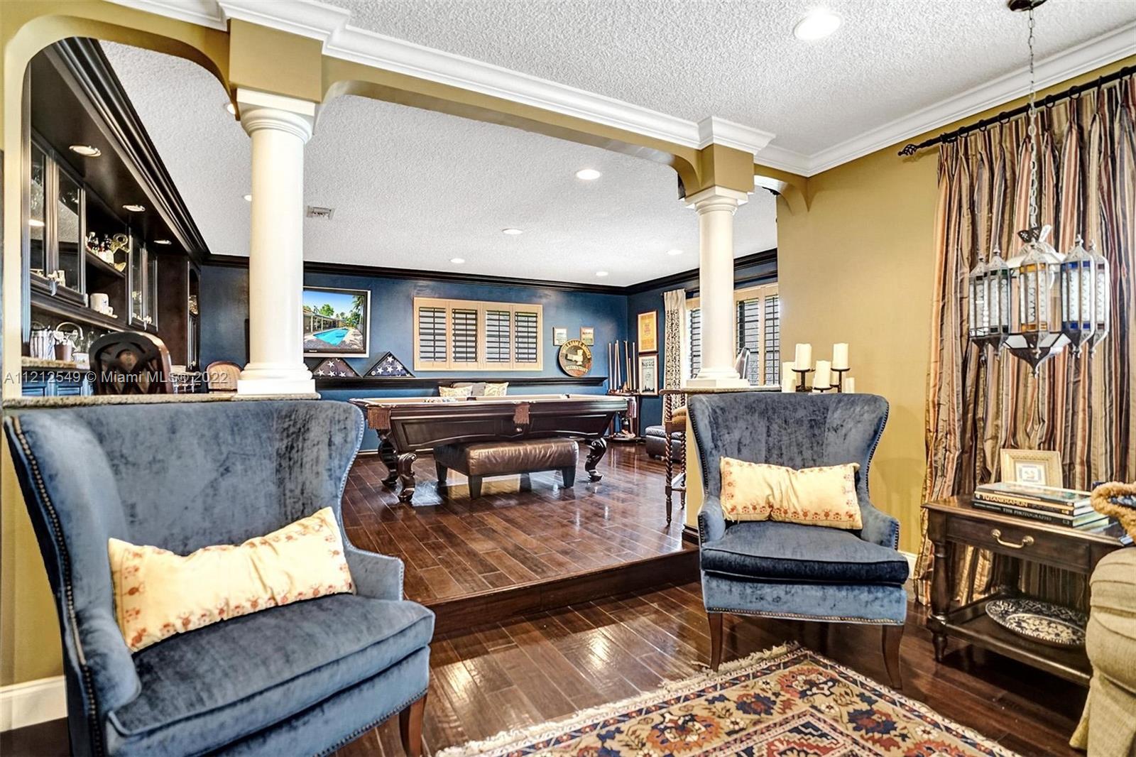 7360 Southwest 16th Street Plantation, FL 33317 - Photo 19 of 70 a living room with furniture and a fireplace