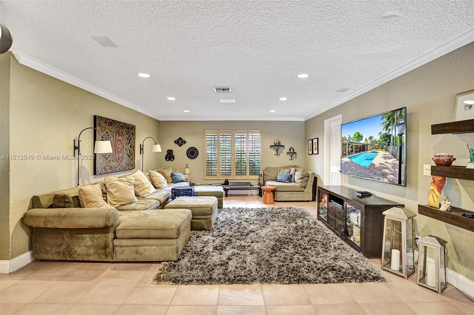 7360 Southwest 16th Street Plantation, FL 33317 - Photo 27 of 70 a living room with furniture and a flat screen tv
