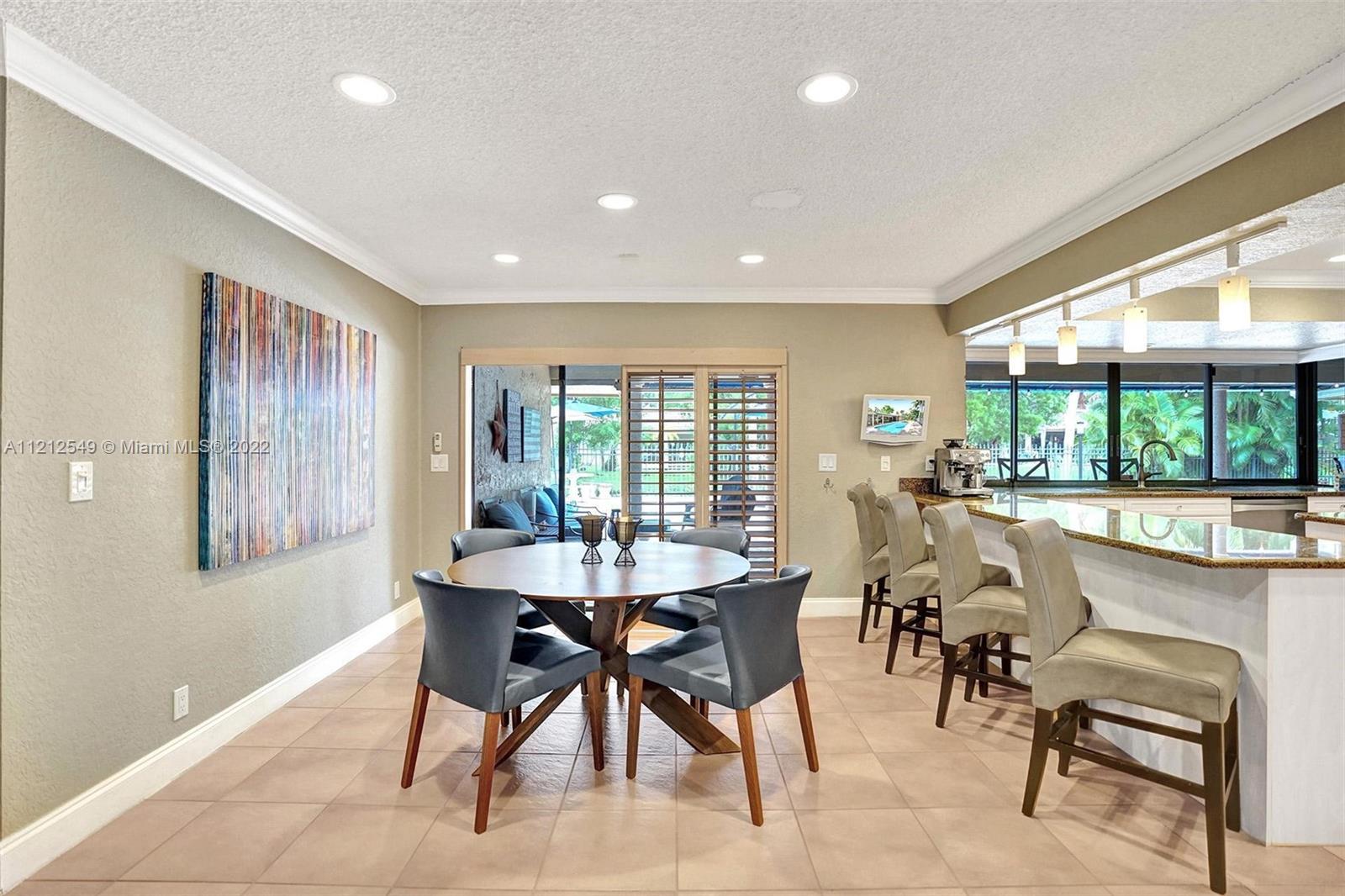 7360 Southwest 16th Street Plantation, FL 33317 - Photo 31 of 70 a view of a dining room with furniture window and outside view