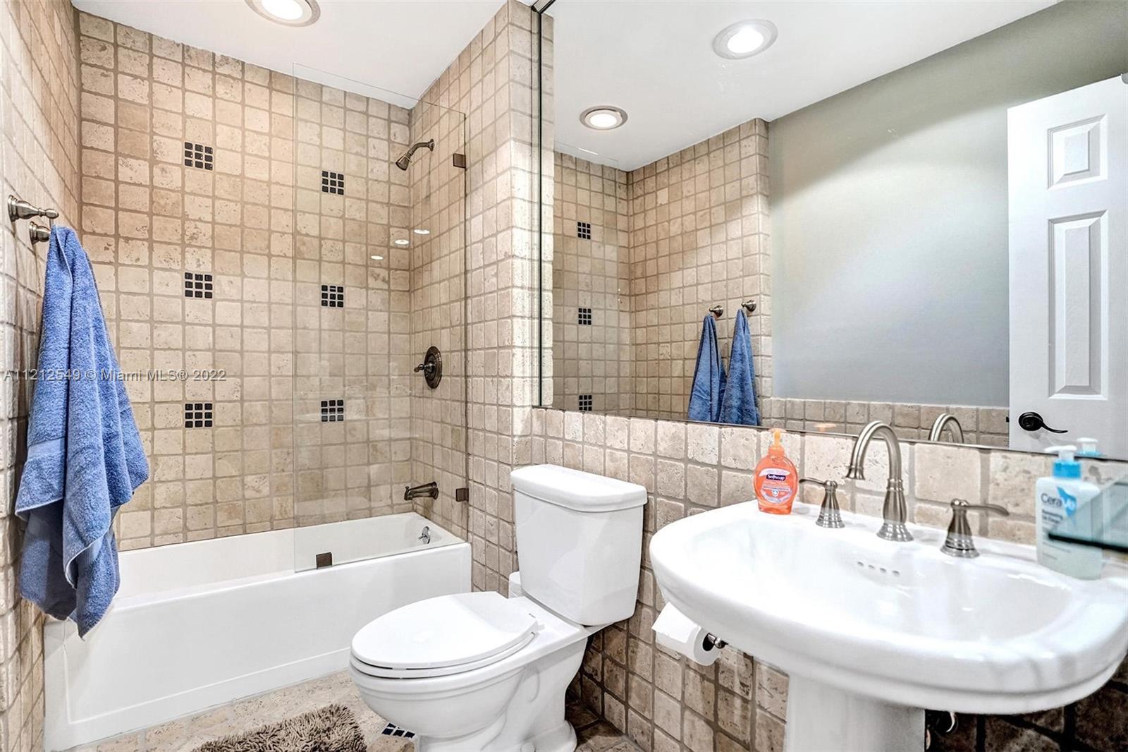 7360 Southwest 16th Street Plantation, FL 33317 - Photo 43 of 70 a bathroom with a sink toilet and shower